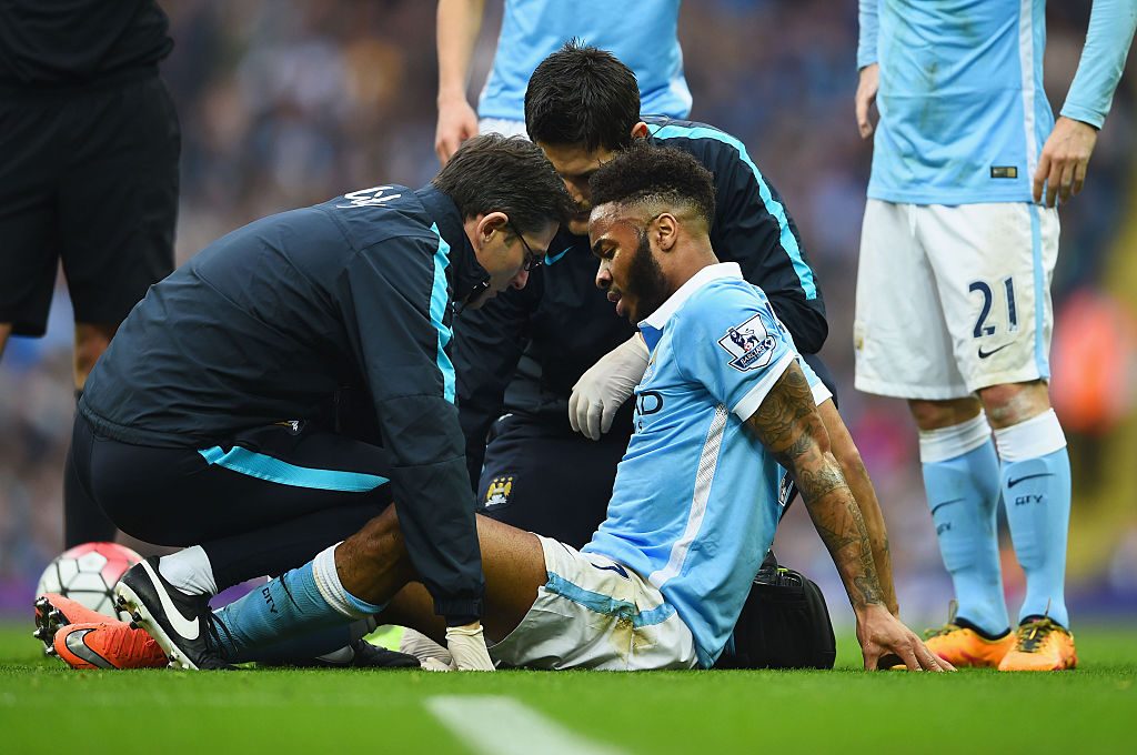 MANCHESTER, ENGLAND - MARCH 20: An injured Raheem Sterling of Manchester City is given treatment during the Barclays Premier League match between Manchester City and Manchester United at Etihad Stadium on March 20, 2016 in Manchester, United Kingdom. (Photo by Laurence Griffiths/Getty Images)