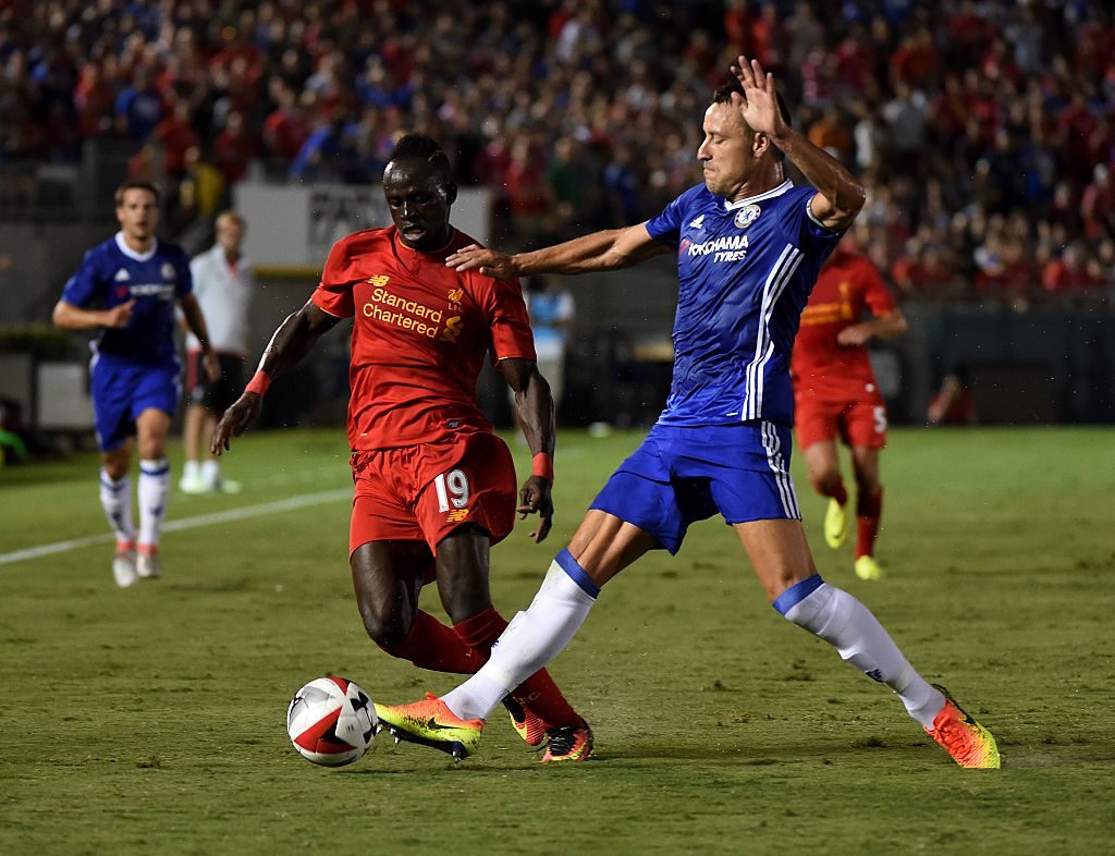 Chelsea's defender John Terry (R) tackles Liverpool's forward Sadio Mane (L) during their International Champions Cup (ICC) football match at the Rose Bowl Stadium in Pasadena, California on July 27, 2016. Chelsea won 1-0. / AFP / Mark Ralston (Photo credit should read MARK RALSTON/AFP/Getty Images)