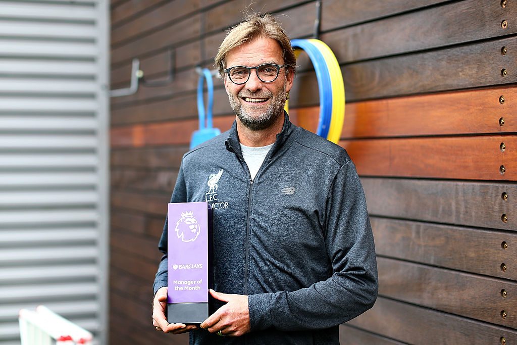 LIVERPOOL, ENGLAND - OCTOBER 13:  Jurgen Klopp poses with the manager of the month trophy at Melwood Training Ground on October 13, 2016 in Liverpool, England.  (Photo by Jan Kruger/Getty Images for Premier League)