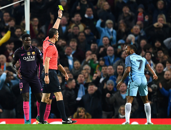 MANCHESTER, ENGLAND - NOVEMBER 01: Raheem Sterling of Manchester City (R) is shown a yellow card during the UEFA Champions League Group C match between Manchester City FC and FC Barcelona at Etihad Stadium on November 1, 2016 in Manchester, England. (Photo by Shaun Botterill/Getty Images)