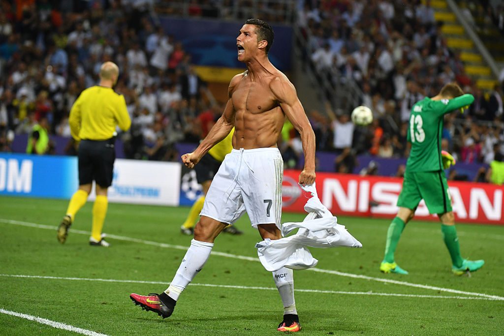 Real Madrid's Portuguese forward Cristiano Ronaldo celebrates after scoring during the penalty shoot-out in the UEFA Champions League final football match between Real Madrid and Atletico Madrid at San Siro Stadium in Milan, on May 28, 2016. / AFP / GERARD JULIEN (Photo credit should read GERARD JULIEN/AFP/Getty Images)