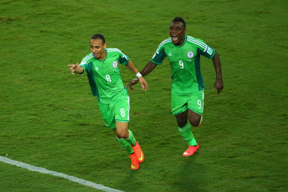 CUIABA, BRAZIL - JUNE 21: Peter Odemwingie of Nigeria (L) celebrates scoring his team's first goal with teammate Emmanuel Emenike during the 2014 FIFA World Cup Group F match between Nigeria and Bosnia-Herzegovina at Arena Pantanal on June 21, 2014 in Cuiaba, Brazil. (Photo by Clive Brunskill/Getty Images)