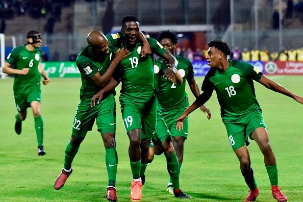 Nigeria's John Ogu (C) celebrates with teammates after scoring a goal during the 2018 FIFA World Cup Group B qualifying football match between Algeria and Nigeria at the Chahid Hamlaou Stadium in Constantine on November 10, 2017. / AFP PHOTO / RYAD KRAMDI (Photo credit should read RYAD KRAMDI/AFP/Getty Images)