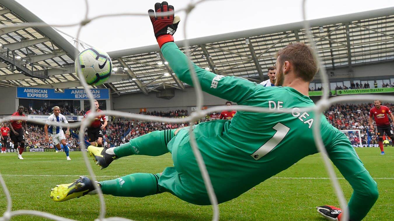 Pascal Gross scores his penalty past David De Gea